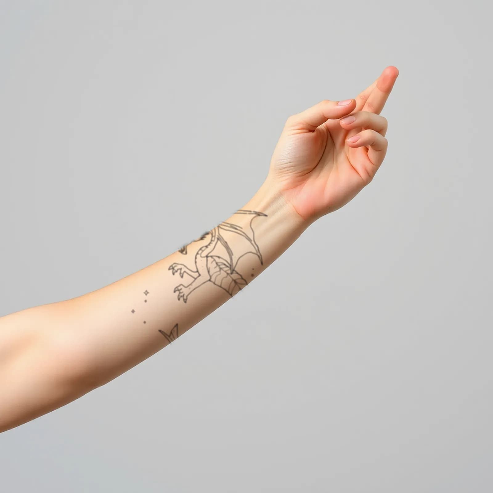 Dragon with Moon Phases tattoo shown on the forearm