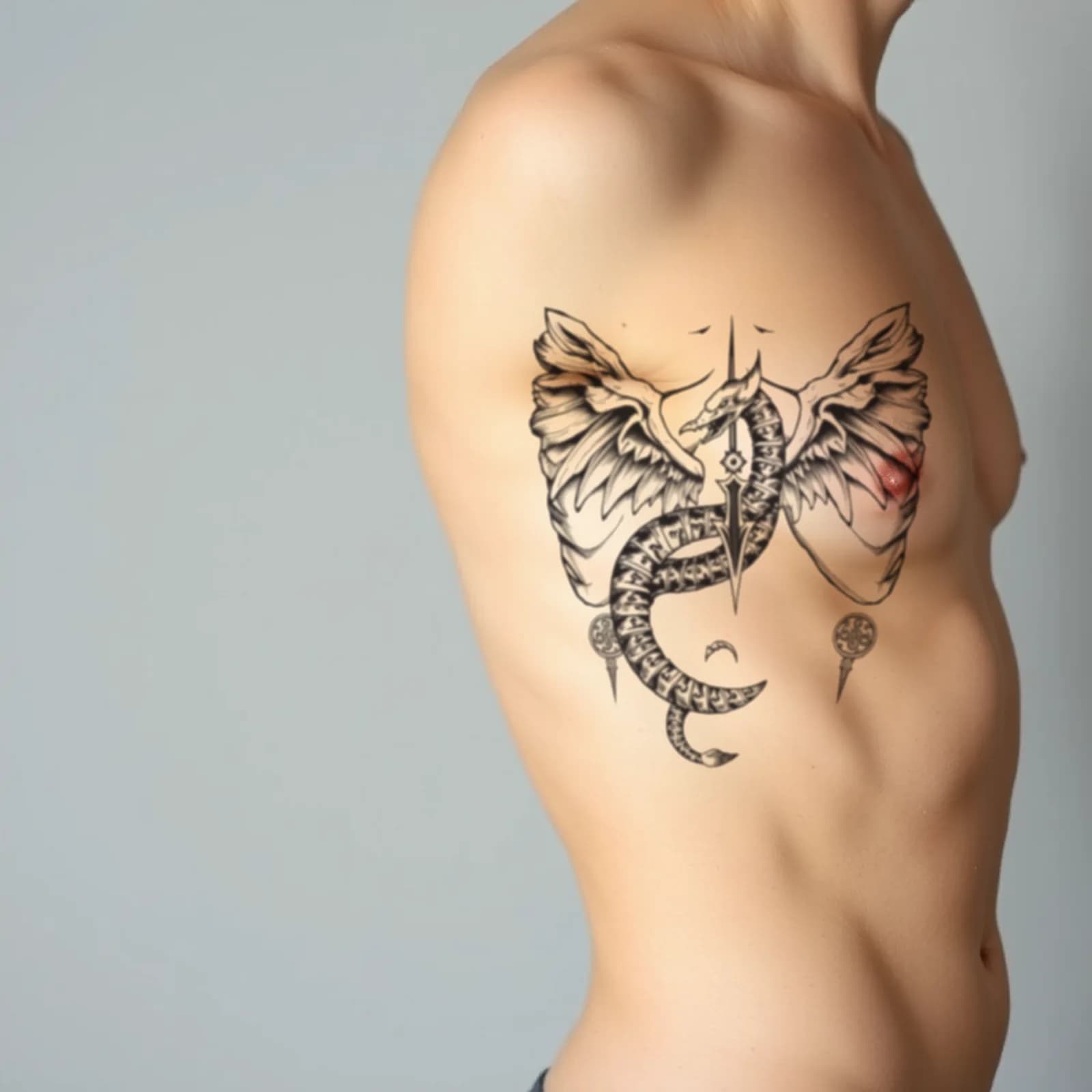 Norse Jormungandr on Ribs tattoo shown on the ribs