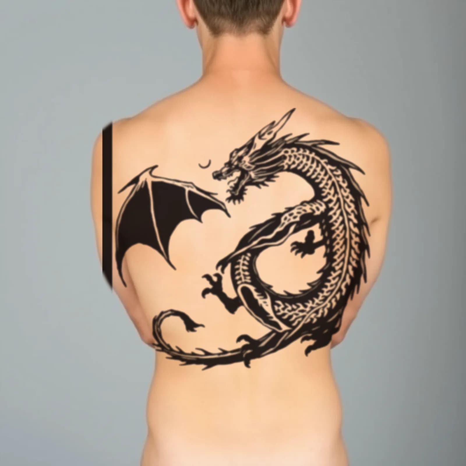 Solid Blackwork Dragon Back tattoo shown on the full back