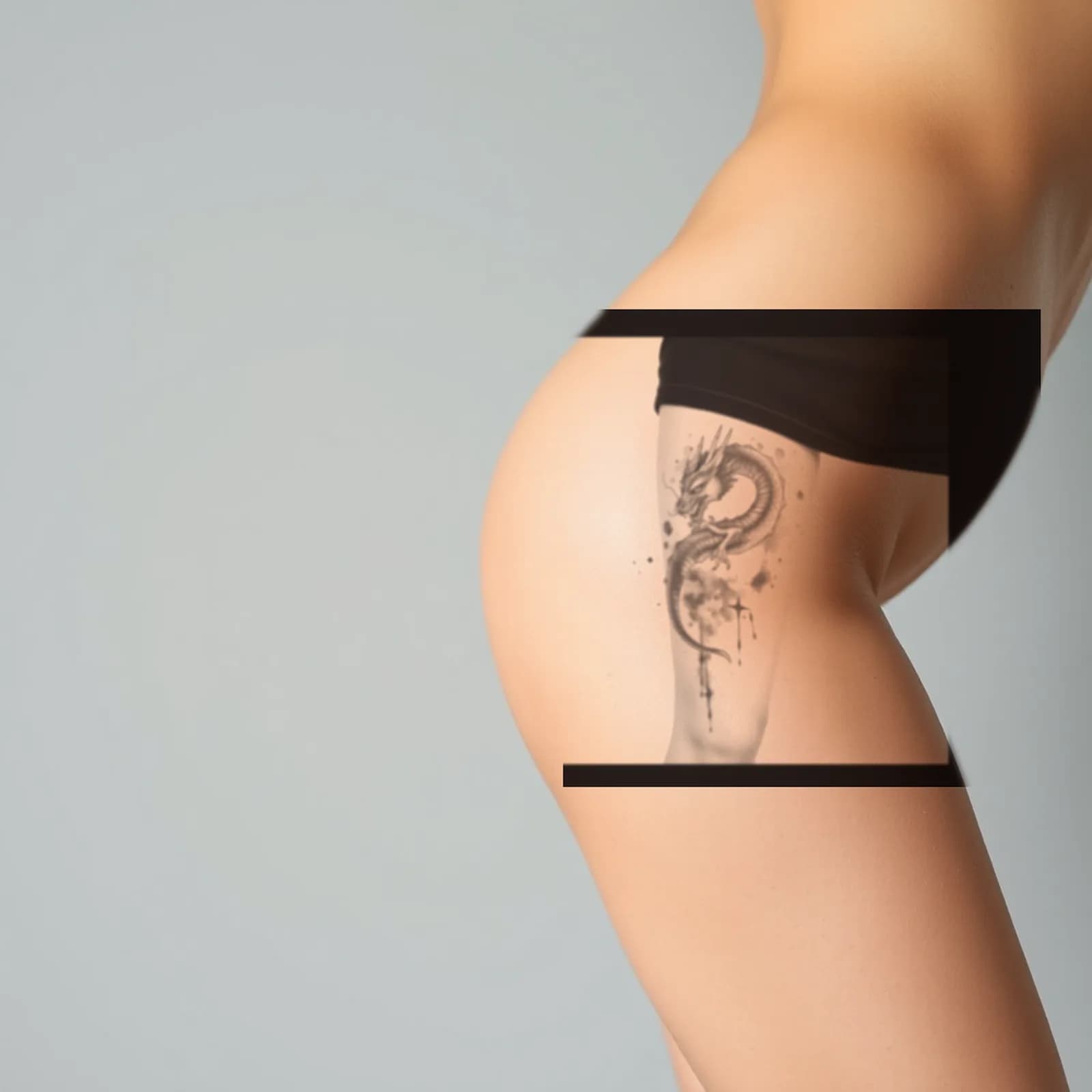 Watercolor Dragon Thigh tattoo shown on the thigh
